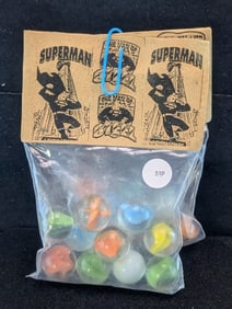 Superman and Popeyes;  Marble in sealed Bags