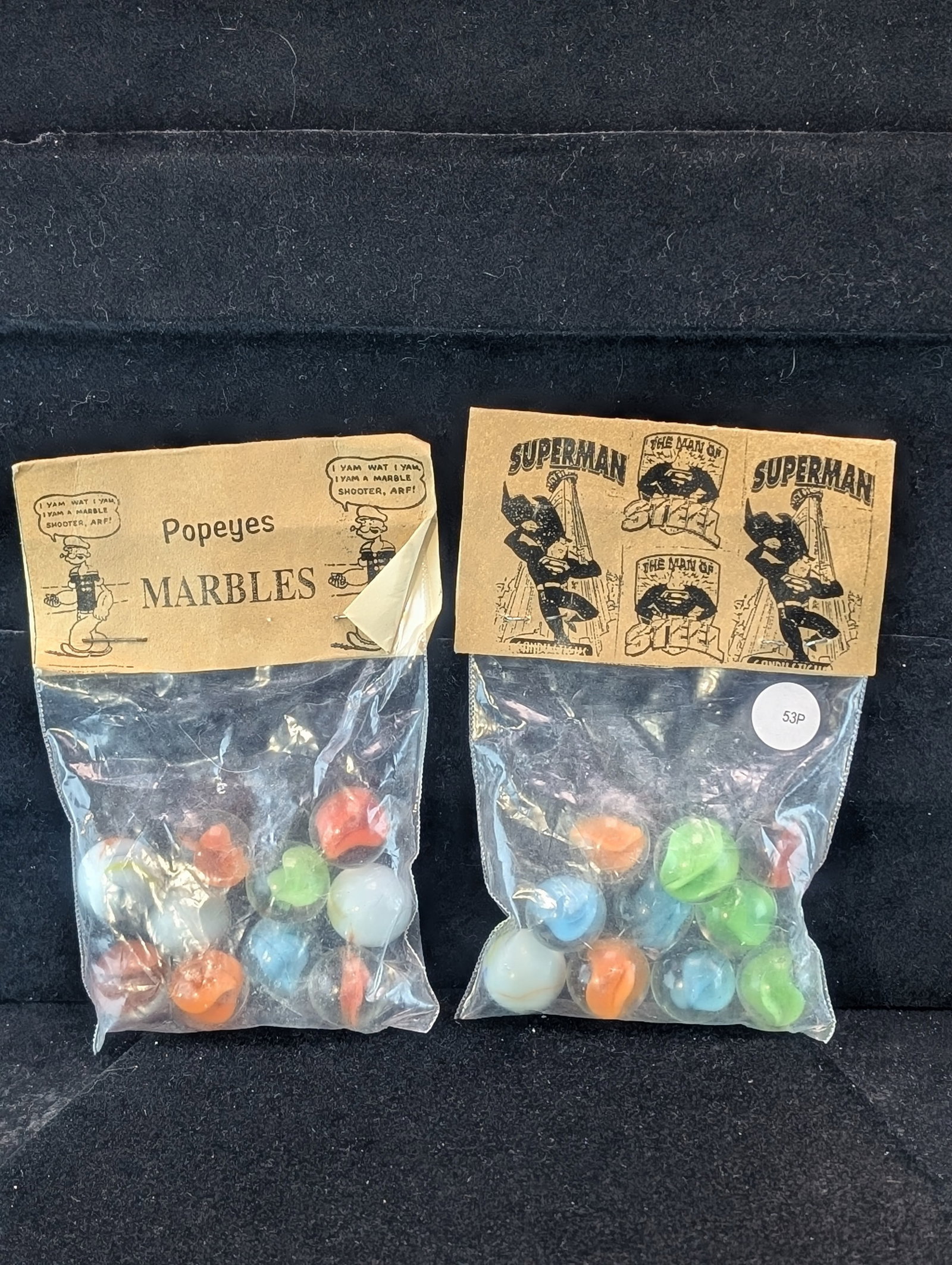 Popeyes and Superman; Marbles in sealed Bags: Popeyes and Superman; Marbles in sealed Bags