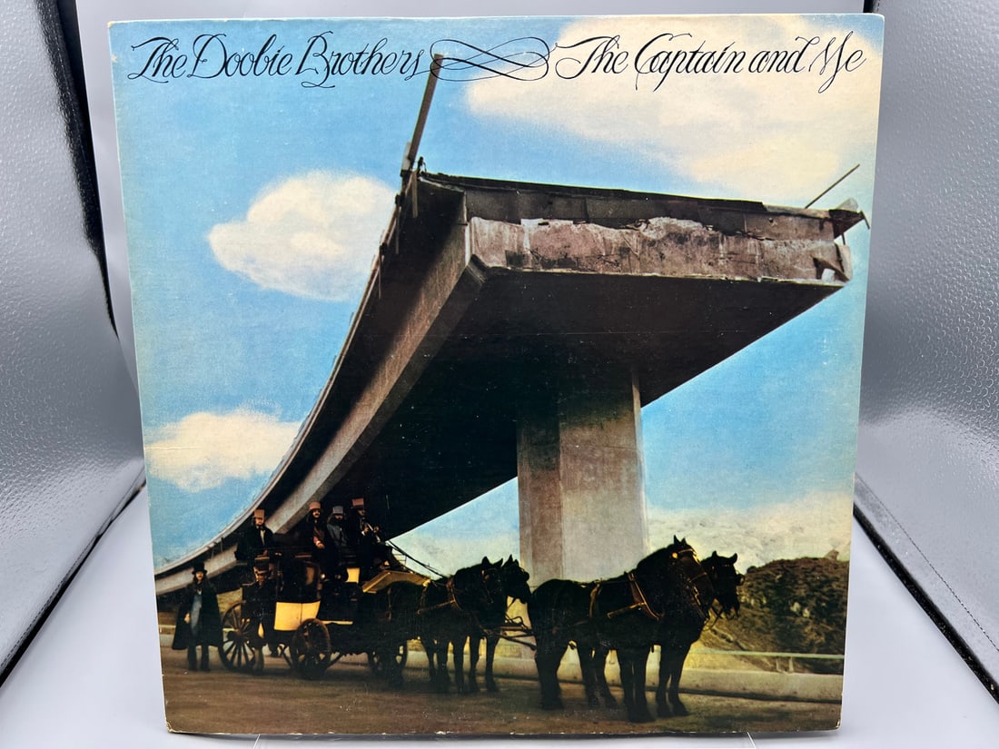 1974 The Doobie Brothers The Captain And Me Repress Vinyl Album - BS 2694: 1974 The Doobie Brothers The Captain And Me Repress Vinyl Album - BS 2694- Records have not been tested by the auction house for play quality. All items are sold as is.