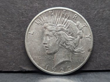 1927 Peace $1. Second lowest mintage in set. AU.