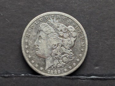 1889-CC Morgan Silver Dollar **Fine/VF**