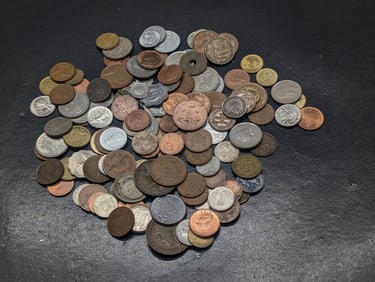 16 ounces plus of unsearched foreign coins.