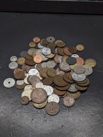 16 ounces plus of unsearched foreign coins.