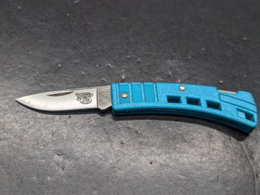 Buck Knife 425 Mini Buck- Blade Embossed with "Outdoor Sports" This model has been discontinued.