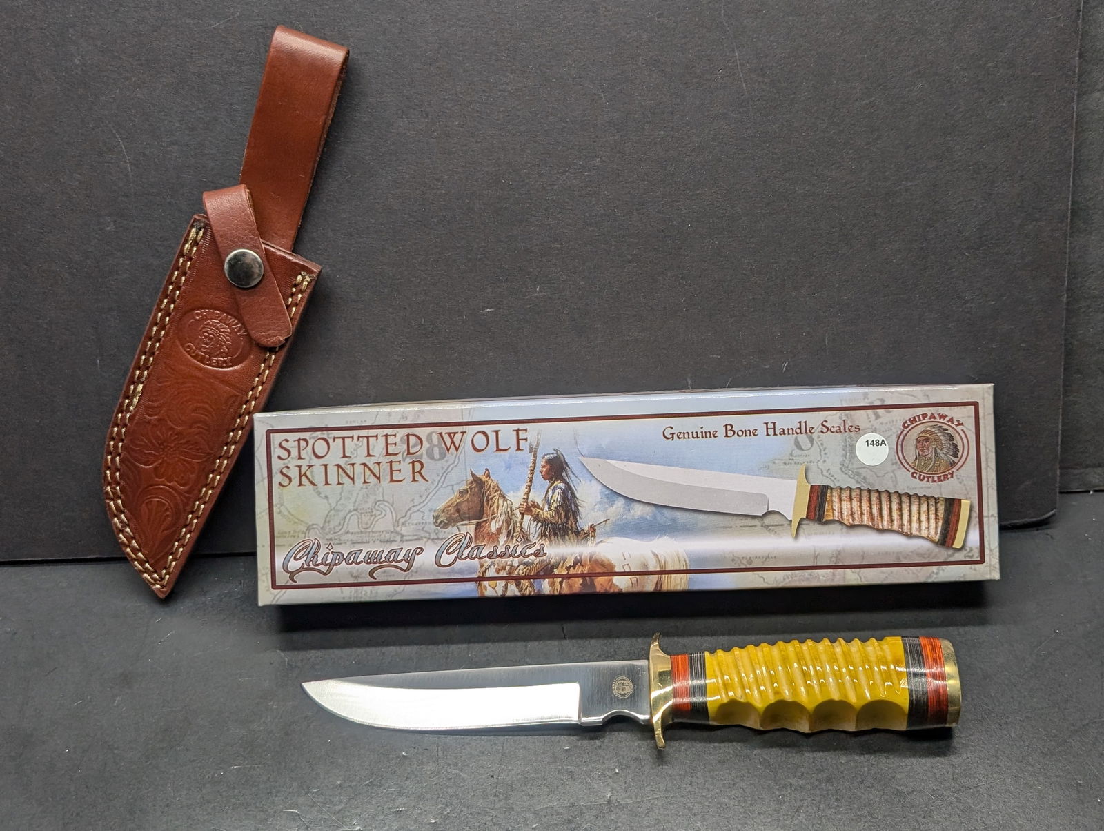 Spotted Wolf Skinner Hunting Knife w/Sheath 5 1/2" Blade, Bone Handles, 10" Overall, Chipaway: Chipaway Cutlery Spotted Wolf Skinner Knife. Features a classic design with a 4-inch stainless steel blade. Crafted with a genuine bone handle showcasing a striking layered pattern in yellow, red, and