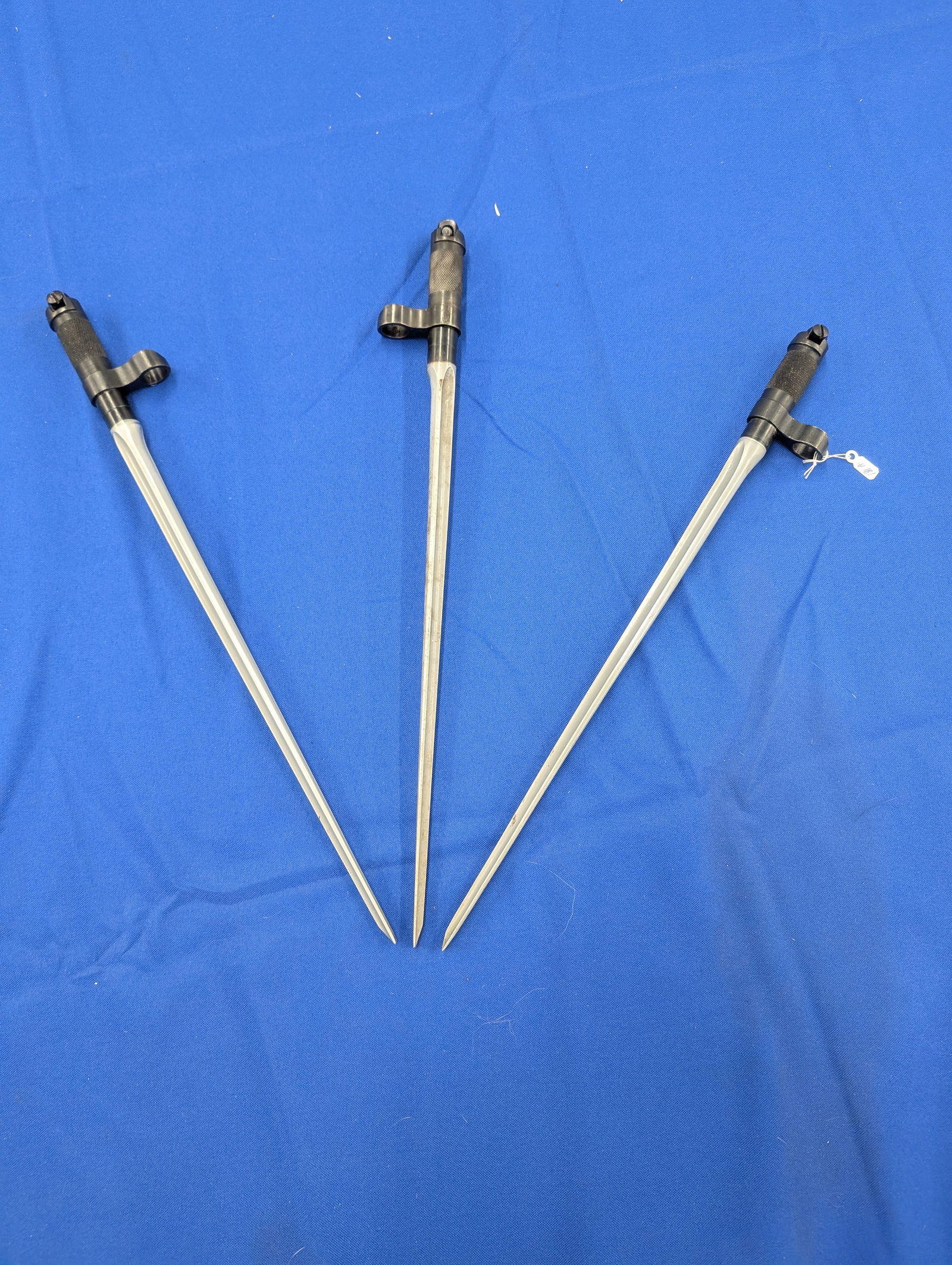 Set of Three Replica British No. 4 Mk II Spike Bayonets – WWII Pattern: Offered here is a matched set of three replica No. 4 Mk II spike bayonets—a faithful reproduction of the utilitarian spike adopted for the British Lee-Enfield No. 4 rifle during World War II. Each b