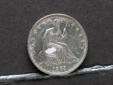 **AU/UNC** 1865 w/ Drapery Seated Liberty Half Dollar
