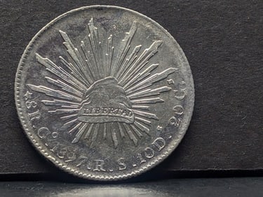 1897 Mexico Caps & Rays Peso "GoRs" 8 Reales AU, 90% Silver