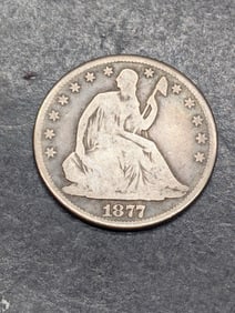 **VG+** 1877 w/ Motto Seated Liberty Half Dollar