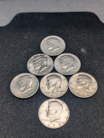 Lot of (7) Mixed Date Kennedy Half Dollars