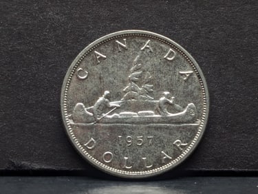 1957 Canada 80% silver $1. Choice AU.