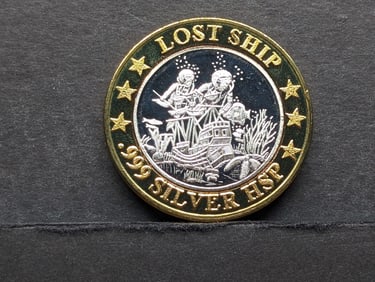 $10 Casino Token with .999 silver HSP center: Norwegian Cruise Lines “Lost Ship.??.
