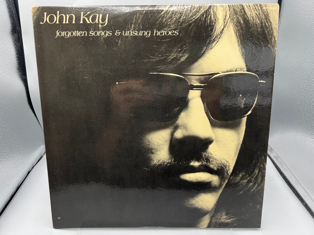 John Kay: Forgotten Songs & Unsung Heroes (1972), includes two lyric sheets with pictures: John Kay: Forgotten Songs & Unsung Heroes (1972), includes two lyric sheets with pictures - Records have not been tested by the auction house for play quality. All items are sold as is.