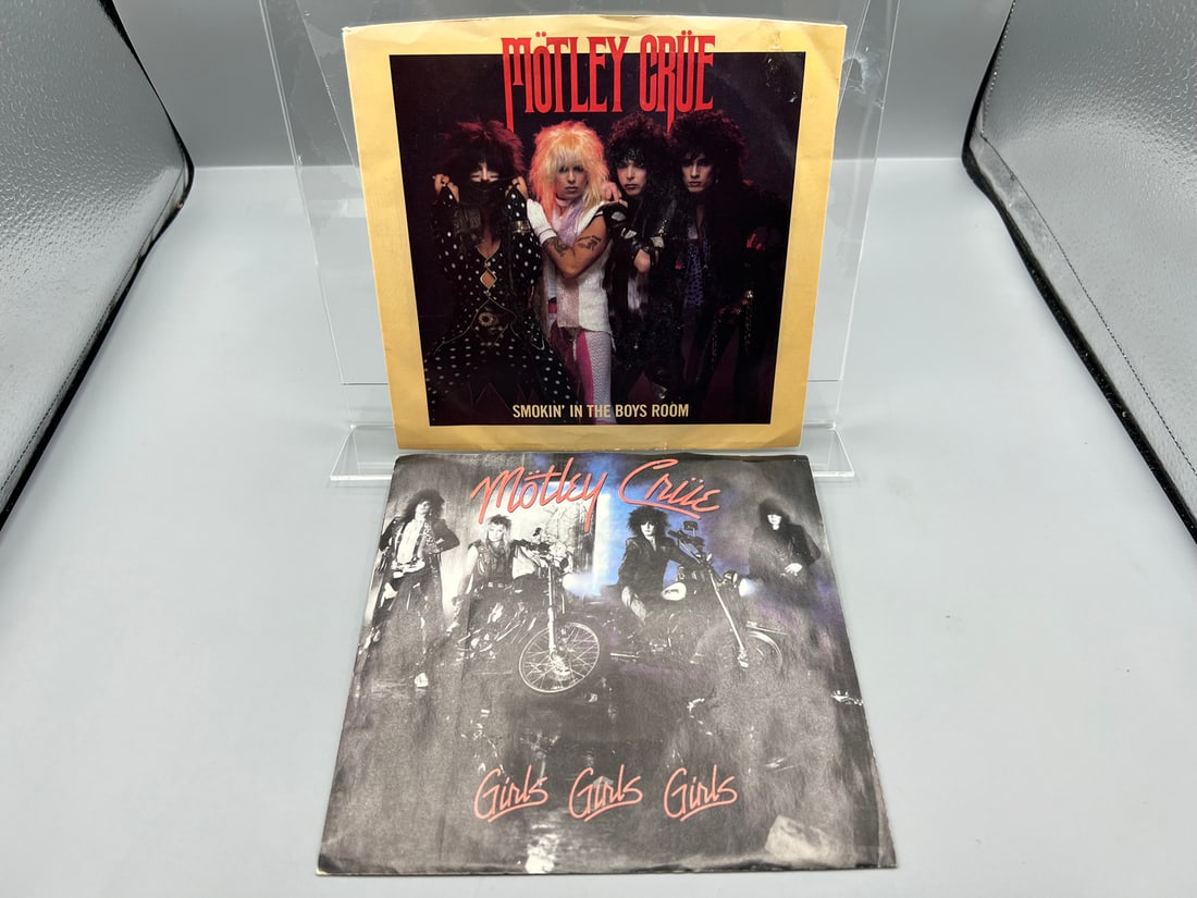 Motley Crue - Two (2) 7-inch 45 rpm records with picture sleeves: Smokin' In The Boys Room/Use It Or (1 of 4)