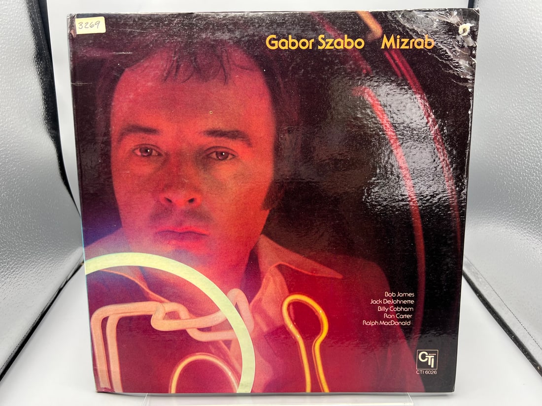 Gabor Szabo: Mizrab (1973), gatefold, promo hole in cover, previous owner filing sticker on cover: Gabor Szabo: Mizrab (1973), gatefold, promo hole in cover, previous owner filing sticker on cover - Records have not been tested by the auction house for play quality. All items are sold as is.