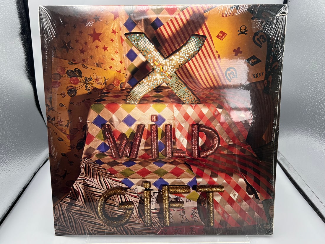 SEALED - X: Wild Gift (1981), promo notch in cover, produced by Doors' Ray Manzarek (Punk): SEALED - X: Wild Gift (1981), promo notch in cover, produced by Doors' Ray Manzarek (Punk) - Records have not been tested by the auction house for play quality. All items are sold as is.