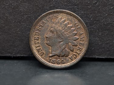 1864 Bronze Indian Head Cent with sharp liberty and luster. AU detail.