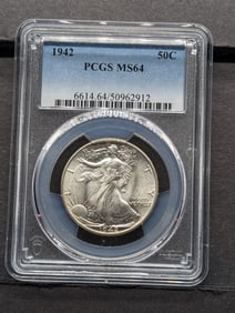 1942 Walking Liberty Half. Slabbed by PCGS, top grader, as MS 64. Nice strike and brilliance.