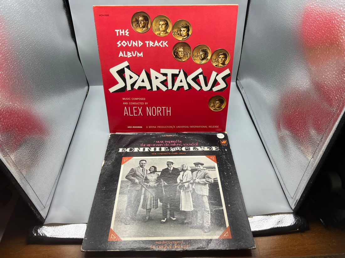 1973 Spartacus Original Soundtrack Reissue & 1968 Bonnie And Clyde Original Motion Picture Score: 1973 Spartacus Original Soundtrack Reissue & 1968 Bonnie And Clyde Original Motion Picture Score Vinyl Albums - MCA-2068 & WS 1742 - Records have not been tested by the auction house for play quality.