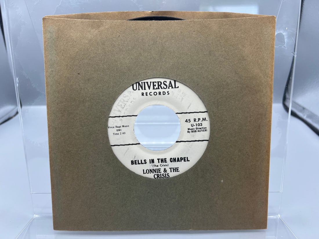 Unknown Release Date Lonnie & The Crisis Santa Town/Bells In The Chapel U.S.A Reissue 45 RPM Record: Unknown Release Date Lonnie & The Crisis Santa Town/Bells In The Chapel U.S.A Reissue 45 RPM Record - U-103 - Records have not been tested by the auction house for play quality. All items are sold as 