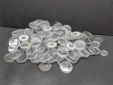 100 Various Denomination Coin Capsules For Displaying Coins.
