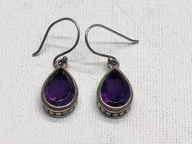 Woman's Sterling Pear Cut Amethyst Pierced Earrings. Marked 925. Weighs 0.14 Troy Ounce (4.6 Grams).