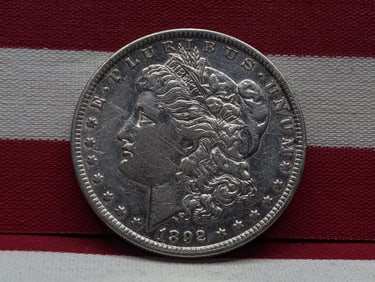 **AU** 1892-O Morgan Silver Dollar