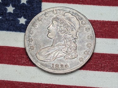 **AU** 1834 Capped Bust Half Dollar