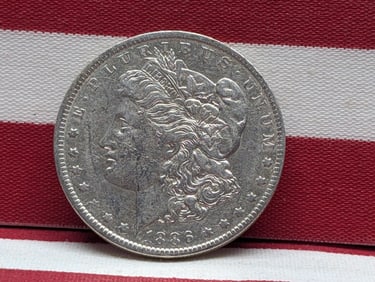 **AU** 1886-O Morgan Silver Dollar