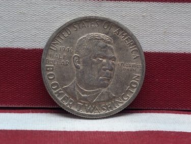 1946 Booker T. Washington Commemorative Silver Half Dollar. OBV: Bust Of BTW. REV: Slave Cabin,