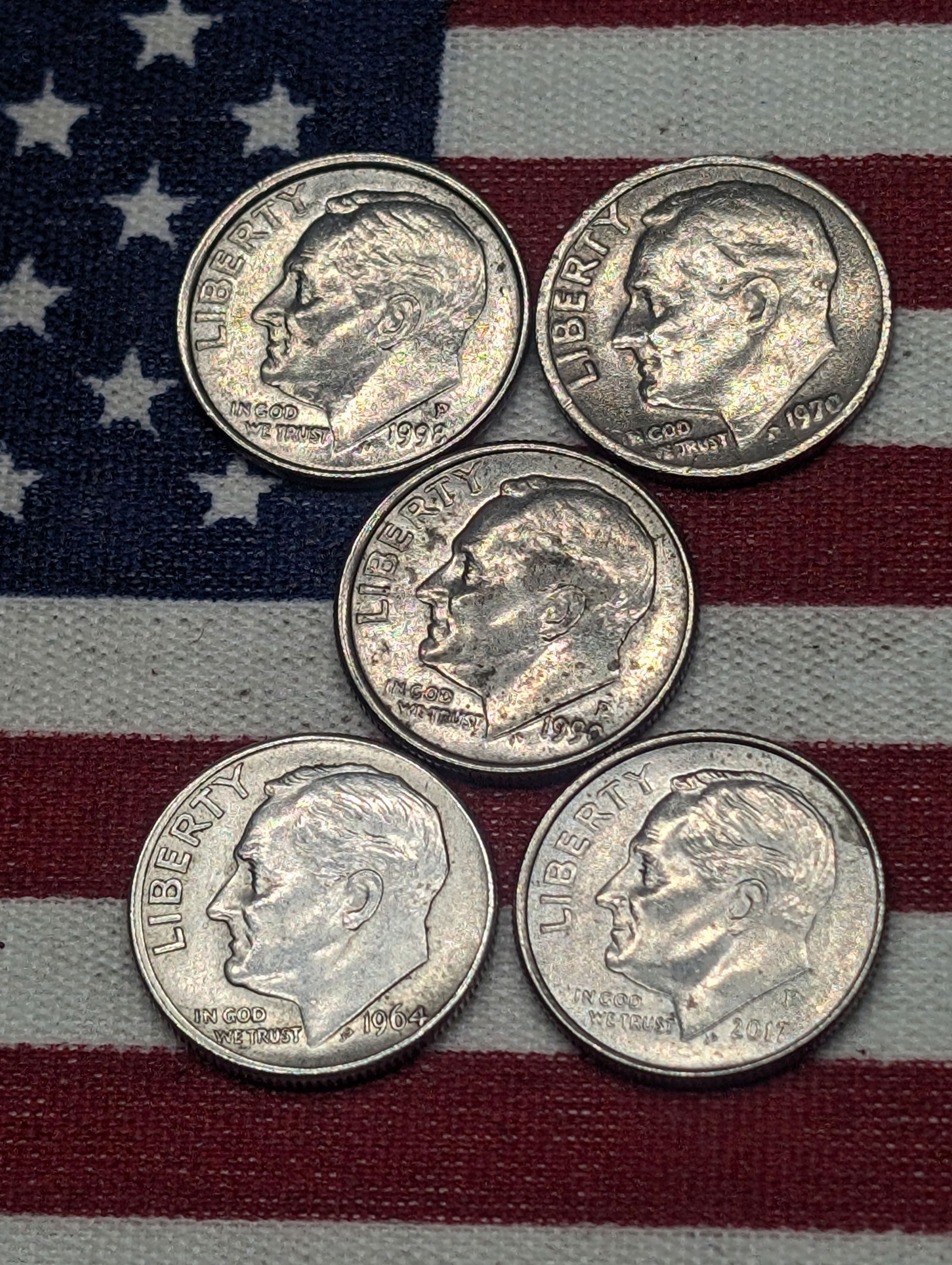 Five (5) Roosevelt Dimes, all off center - one is 1964 silver (1 of 2)