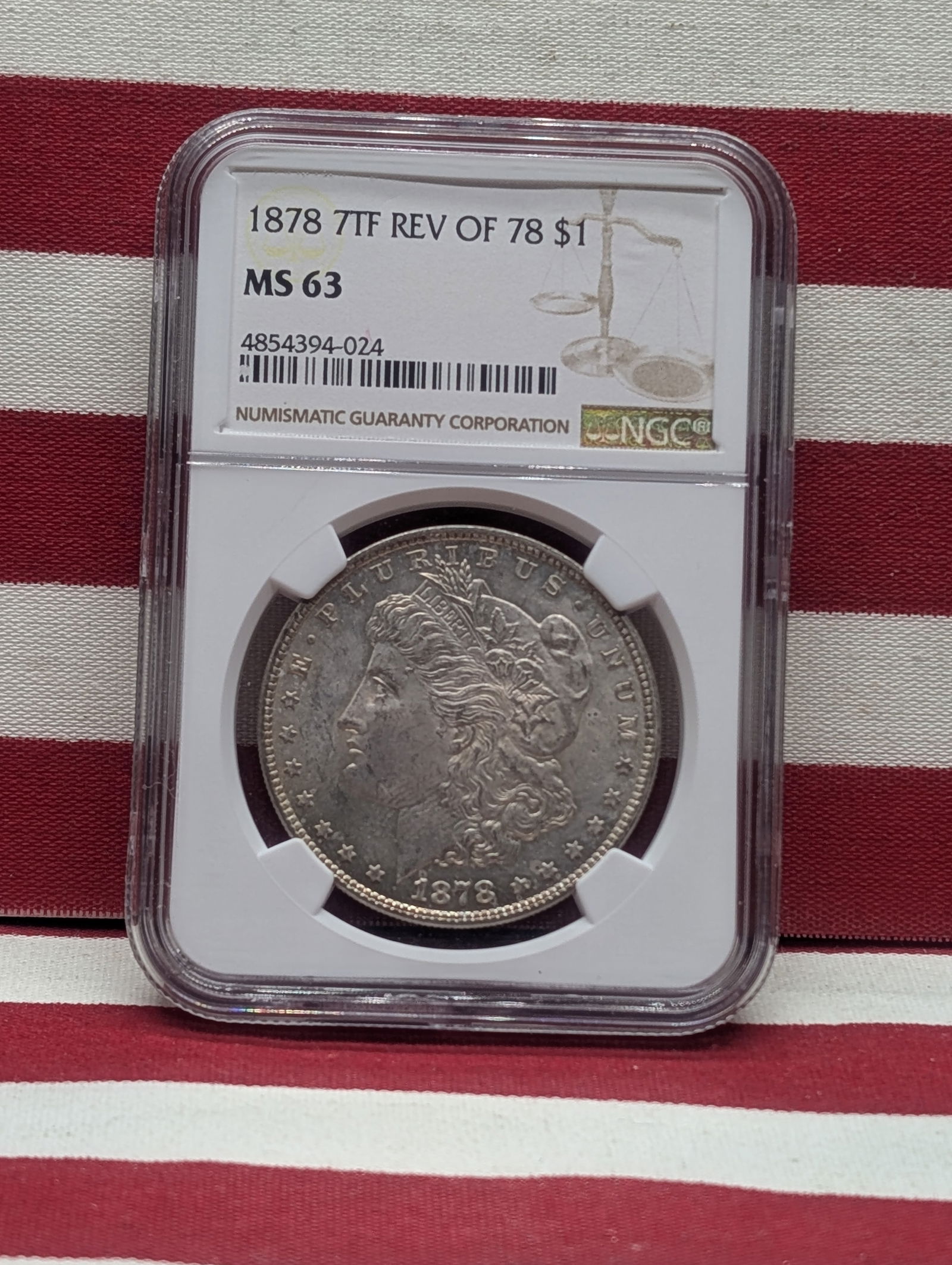 1878-P 7tf Reverse Of 1878 United States Morgan Silver Dollar Graded MS63 By NGC Grading Company. (1 of 3)
