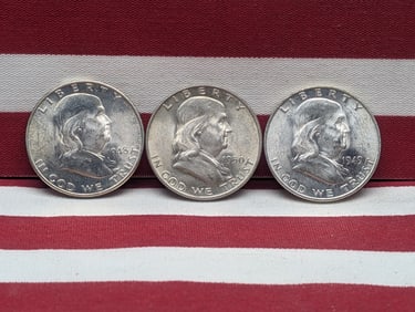 1948-D 1949-D 1950-D Uncirculated Franklin Half Dollars.