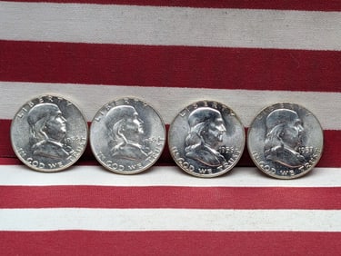 1954 1955 1956 1957 Uncirculated Franklin Half Dollars.