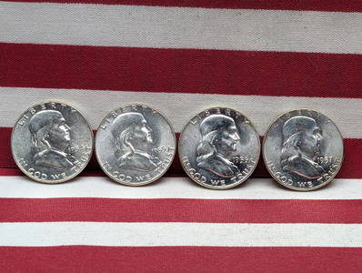 1954 1955 1956 1957 Uncirculated Franklin Half Dollars.