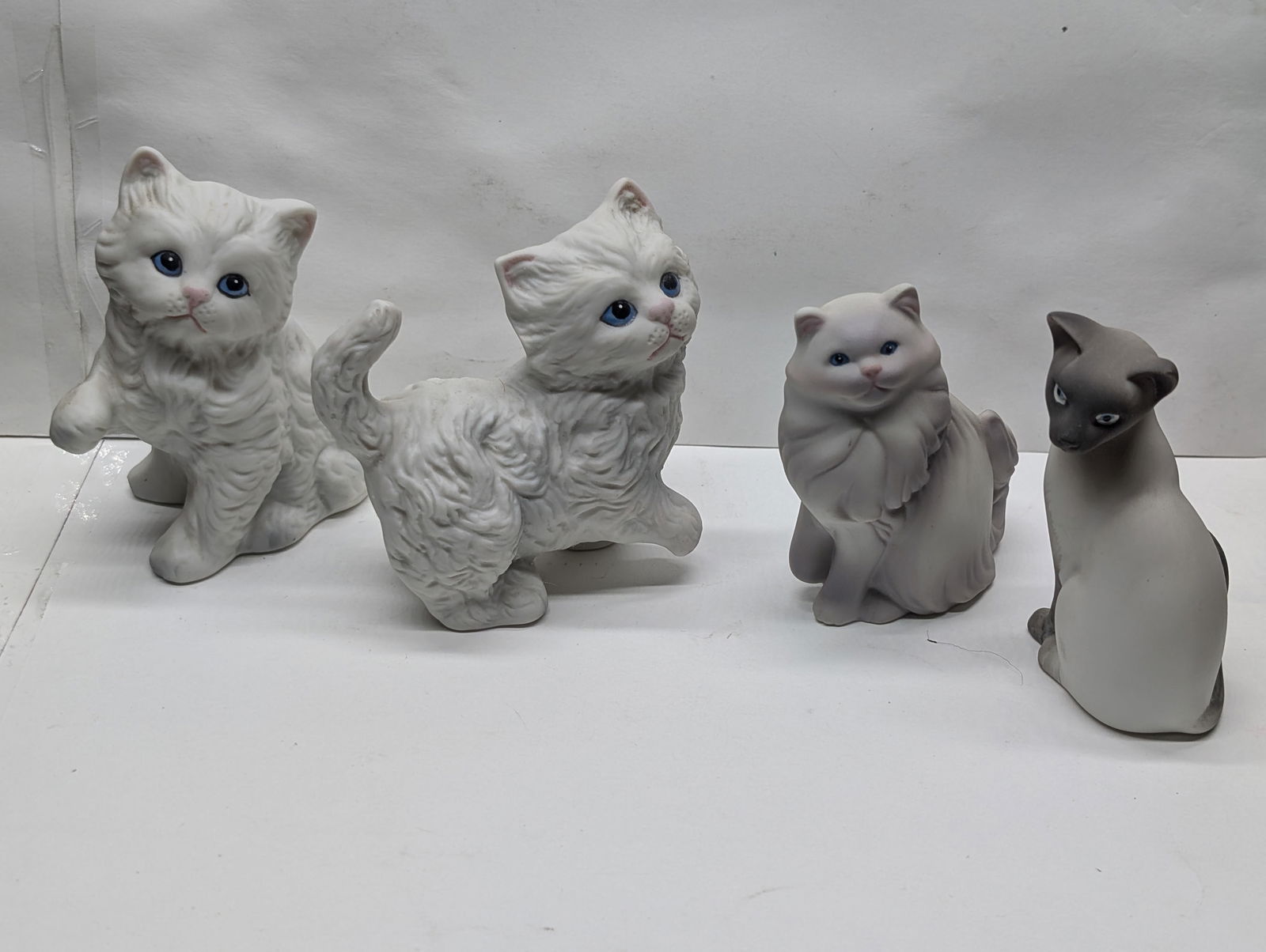 Four Small Ceramic Cat Figurines (1 of 7)