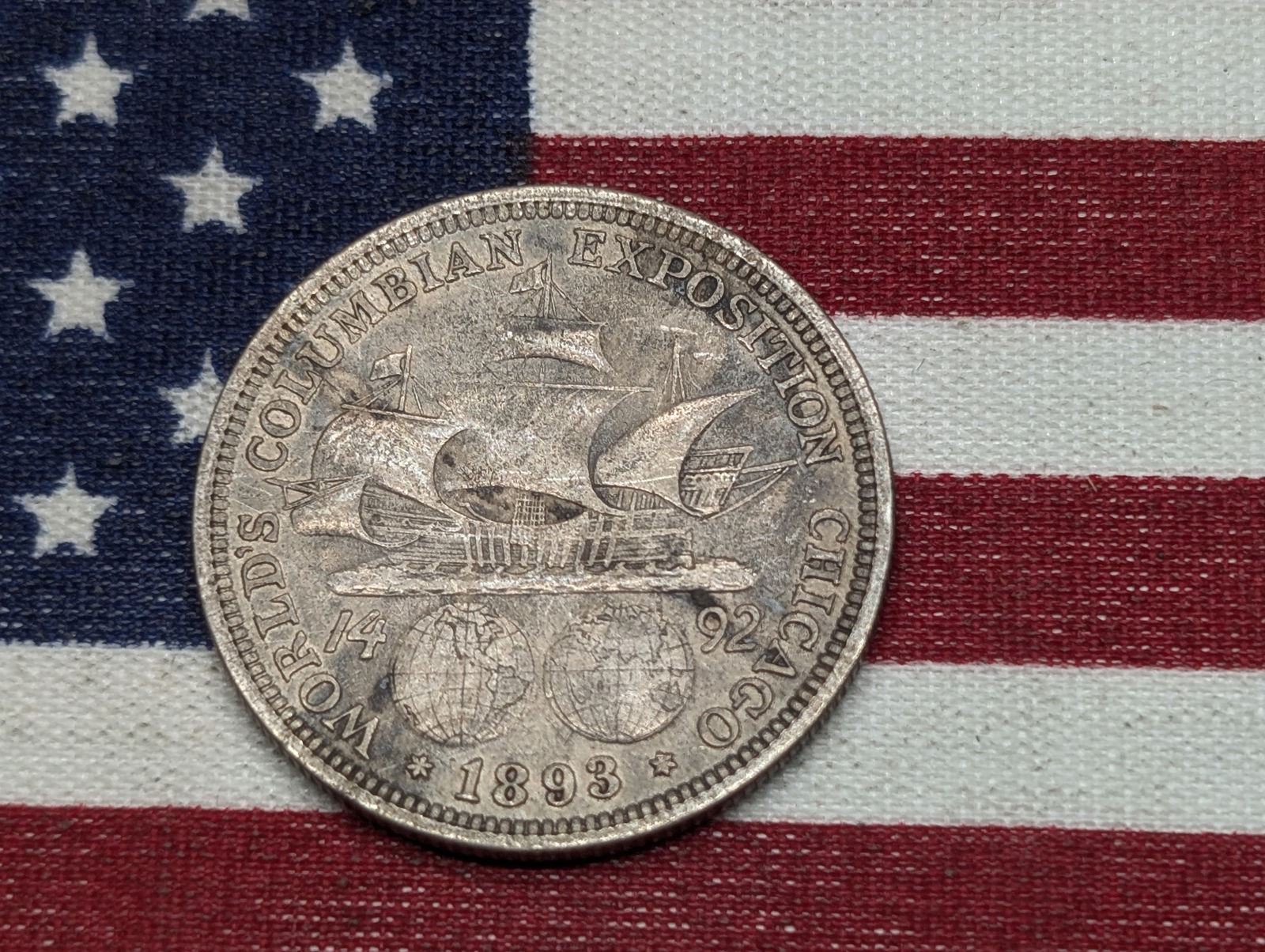 1893 Columbian Exposition Commemorative Silver Half Dollar.  OBV: Santa Maria, 2 Globes.  REV: (1 of 2)