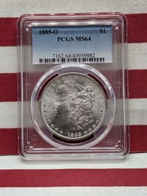 1885-O Morgan Dollar. Slabbed by PCGS, top grader, as MS64. Nice white coin with great luster.