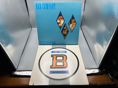 Bad Company (2 LP Lot): Rough Diamonds (1982), serrated die-cut cover, small ink mark on cover; and
