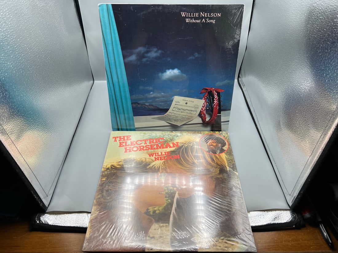 SEALED - Willie Nelson (2 LP Lot): Without A Song (1983); and The Electric Horseman - Original: SEALED - Willie Nelson (2 LP Lot): Without A Song (1983); and The Electric Horseman - Original Motion Picture Soundtrack (1979). Both albums are SEALED - Records have not been tested by the auction ho