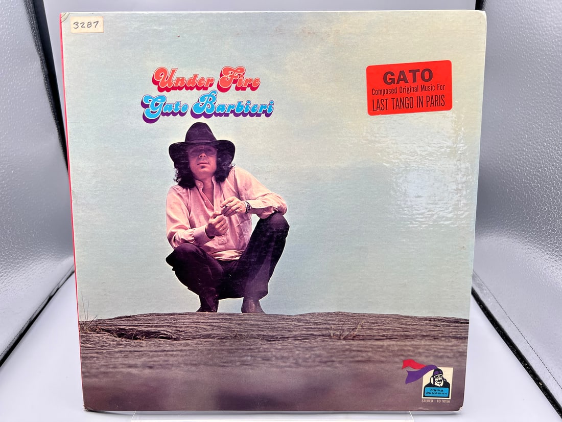 Gato Barbieri: Under Fire (1973), white label promo, hype sticker on cover, gatefold: Gato Barbieri: Under Fire (1973), white label promo, hype sticker on cover, gatefold - Records have not been tested by the auction house for play quality. All items are sold as is.