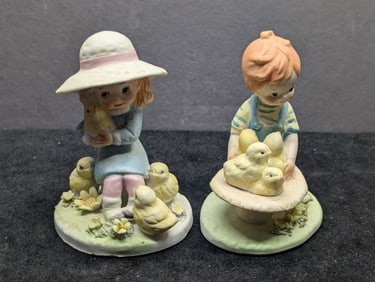Boy and Girl with Chicks Porcelain Figurines Hand-painted porcelain figurines featuring a young boy
