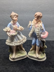 Pair of Porcelain Figurines - Boy with Pink Hat & Girl with Basket of Flowers - Lace Trim Accents -