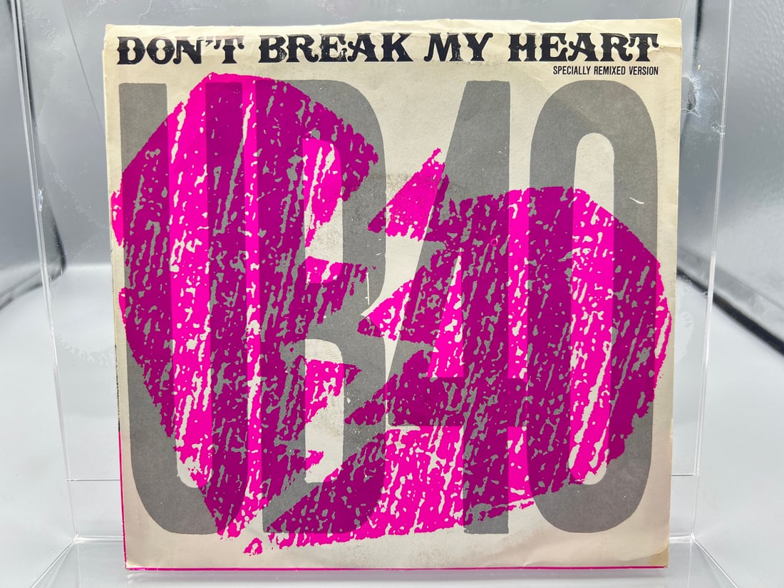 1985 UB40 Don't Break My Heart/Mek Ya Rok 45 RPM Record W/ Picture Sleeve - AM-2792: 1985 UB40 Don't Break My Heart/Mek Ya Rok 45 RPM Record W/ Picture Sleeve - AM-2792 - Records are untested by auction house for play quality. All items are sold as is.