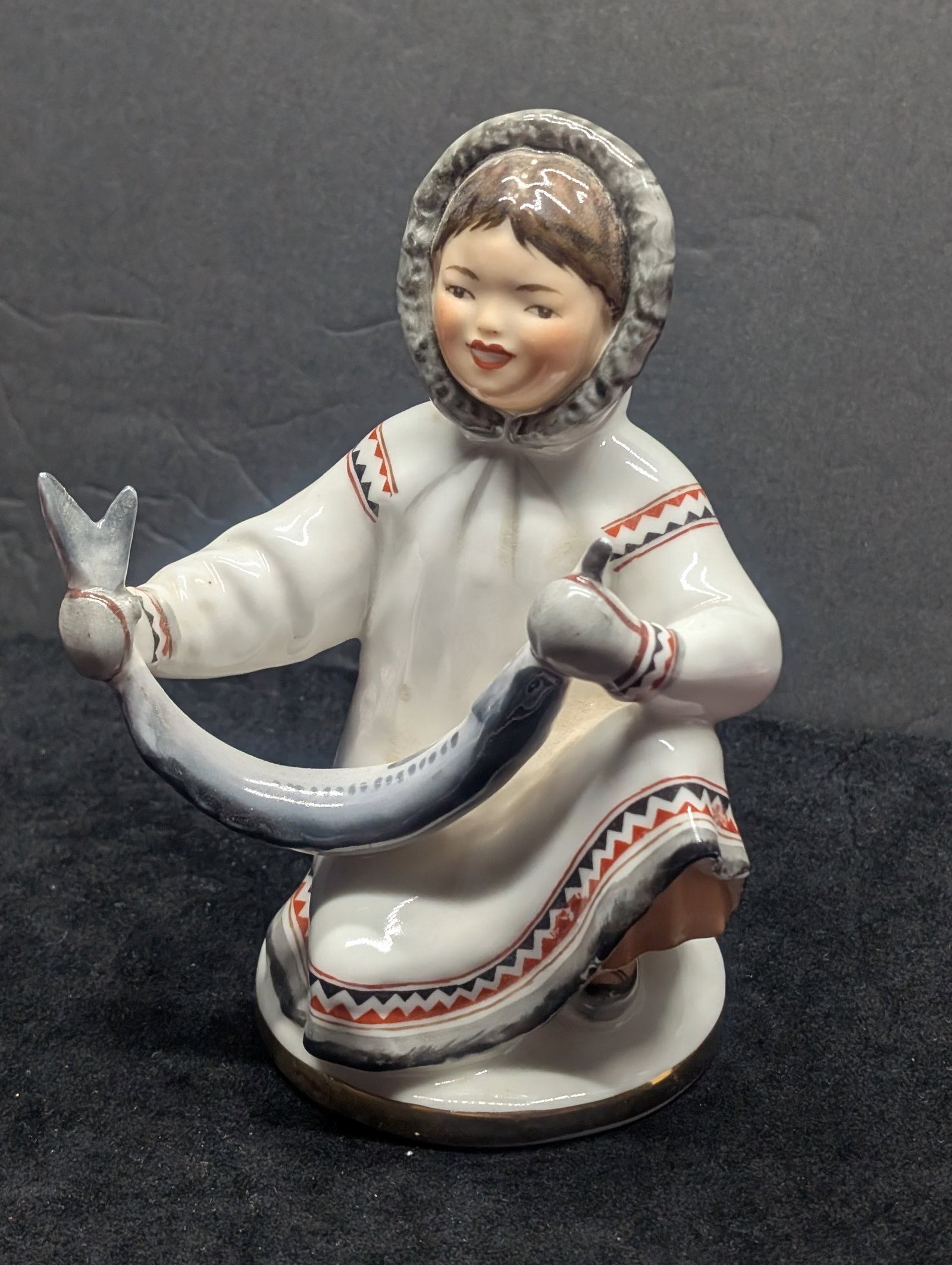 Soviet Porcelain Figurine – Inuit/Chukchi Child with Fish, Lomonosov Factory (USSR, ca.: Soviet Porcelain Figurine – Inuit/Chukchi Child with Fish, Lomonosov Factory (USSR, ca. 1950s–1980s)