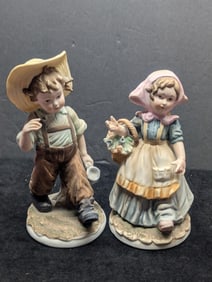 Pair of George Z. Lefton porcelain figurines KW4243, boy with jug in farmer’s hat and girl with