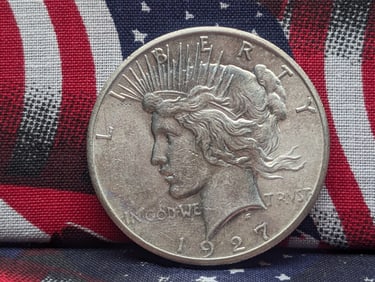 1927 Peace Dollar. 2nd lowest mintage in set. AU.