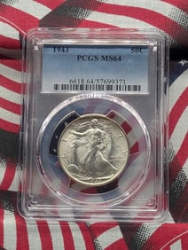 1943 Walking Liberty Half. Slabbed by PCGS, top grader, as MS 64. A white blazer.