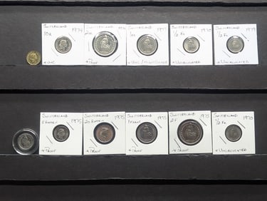 12 Assorted Switzerland (Swiss Confederation) coins.