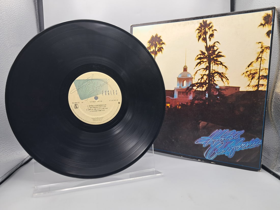 1976 The Eagles Hotel California Vinyl Album - 7E-1084: 1976 The Eagles Hotel California Vinyl Album - 7E-1084 - Records have not been tested by the auction house for play quality. All items are sold as is.